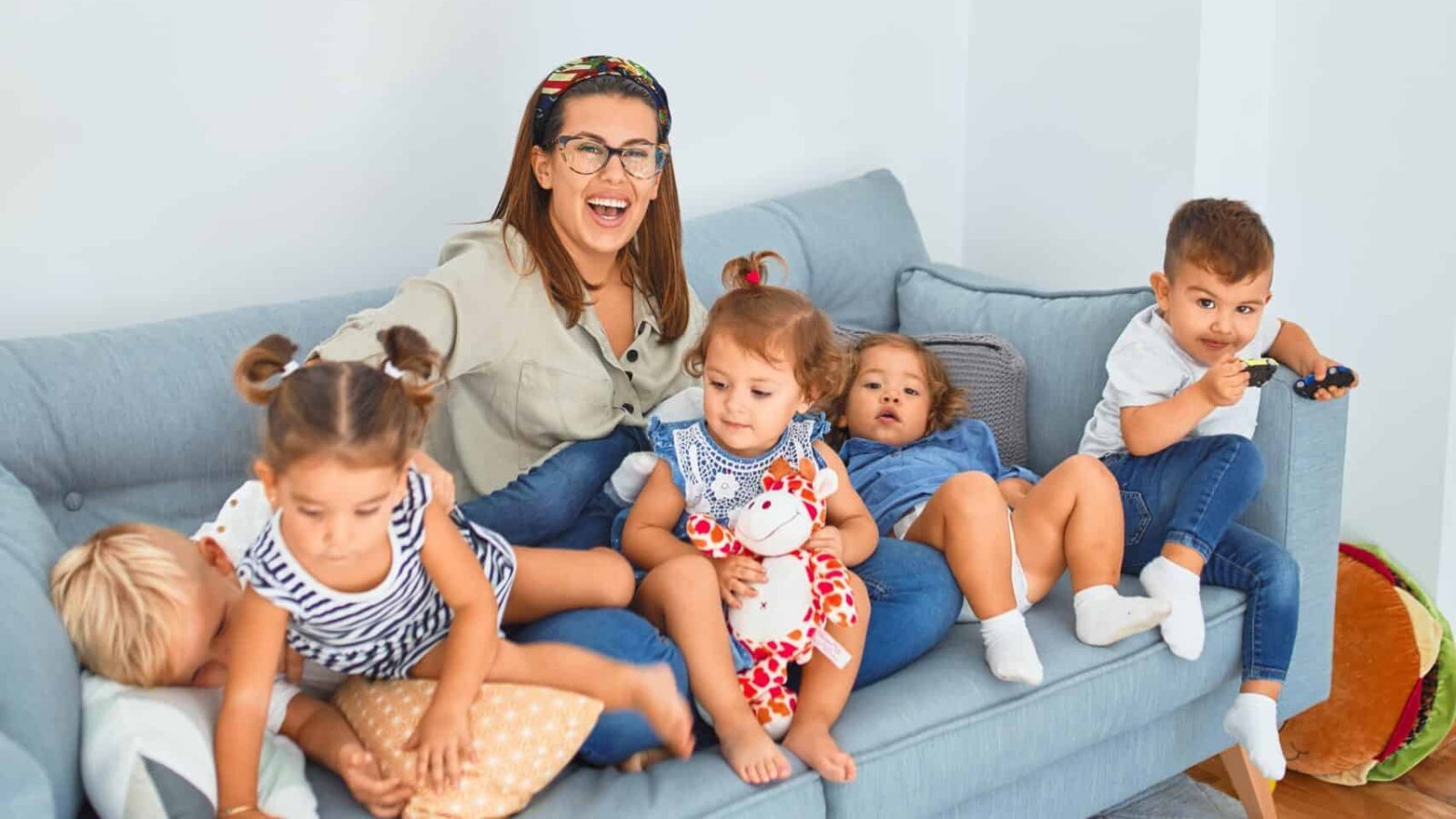 Photo by krakenimages 3 women sitting on gray couch