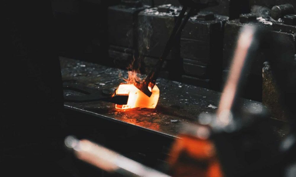 person holding forging tong